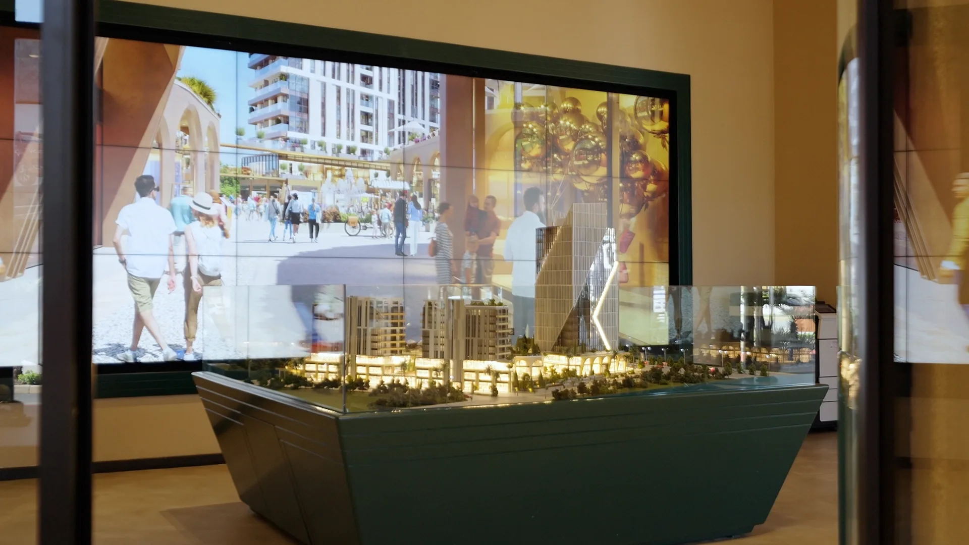 Scale model in front of the media wall